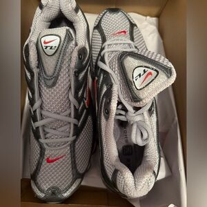 Grey with accents of red Nike shox TL IV